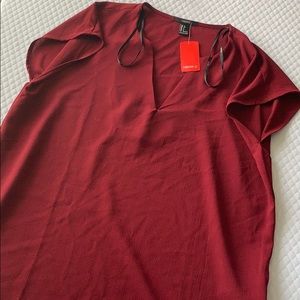 polyester light top with v cut. NWT